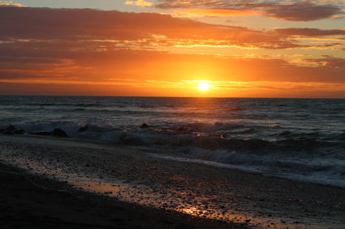 Hokitika BeachSunset across the Tasman Sea on the West Coast of the South Island, New Zealand