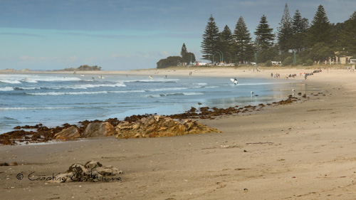 Mount Maunganui Beach with people enjoying the surf, Tauranga, Bay of Plenty